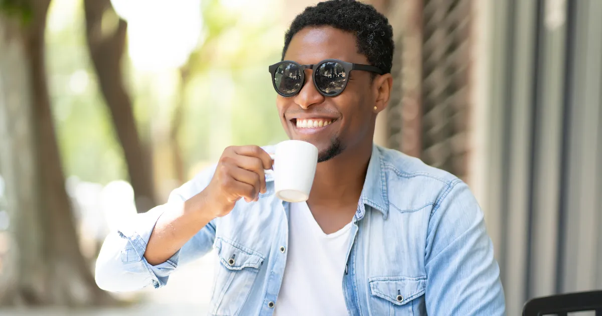 Man Smiling Drinking Coffee
