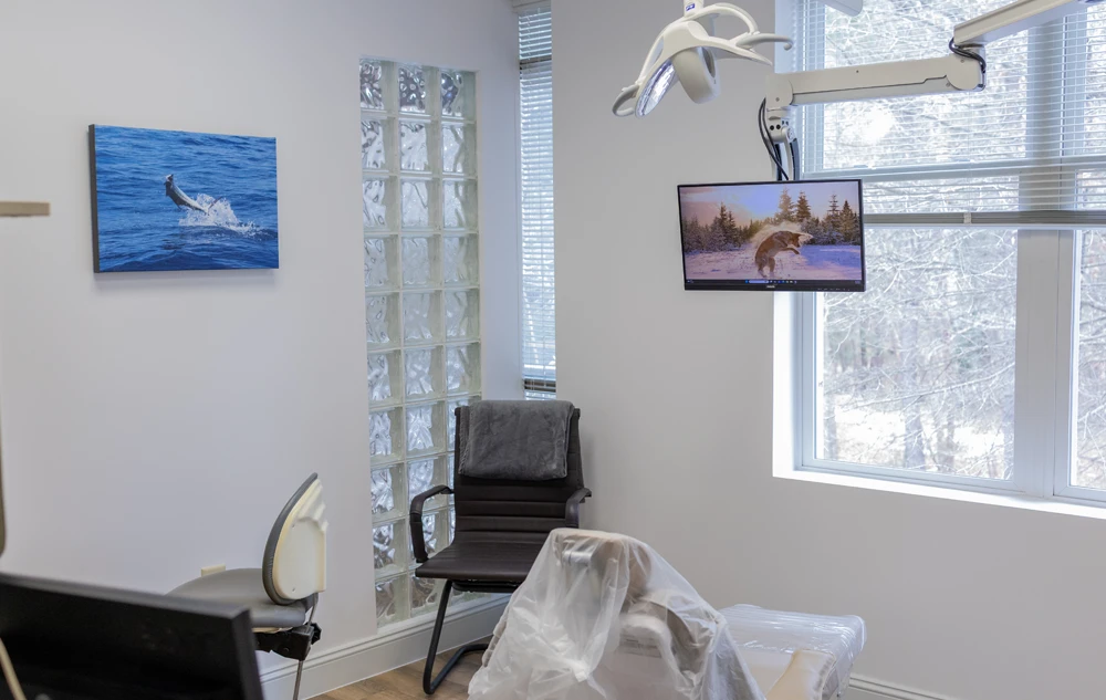 bright dental treatment room with modern equipment in creedmoor road dental office