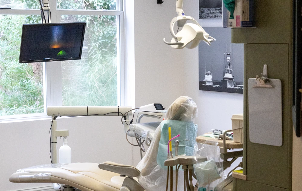 Modern Dental Treatment room with chair and equipment in creedmoor road dental office