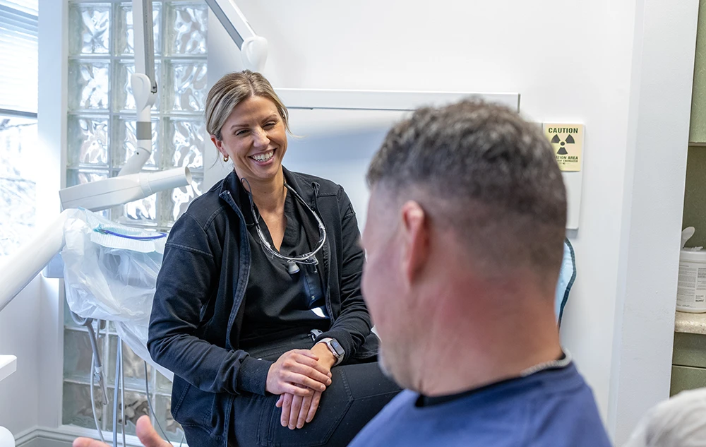 Dental Hygienist Talking To A Patient