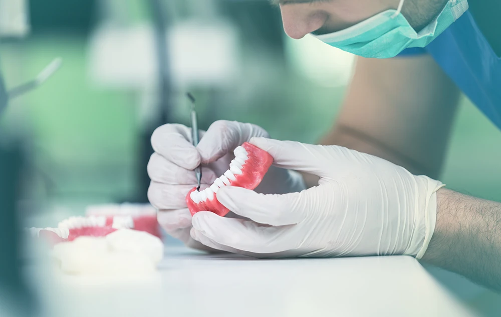 Technician Crafting Dentures